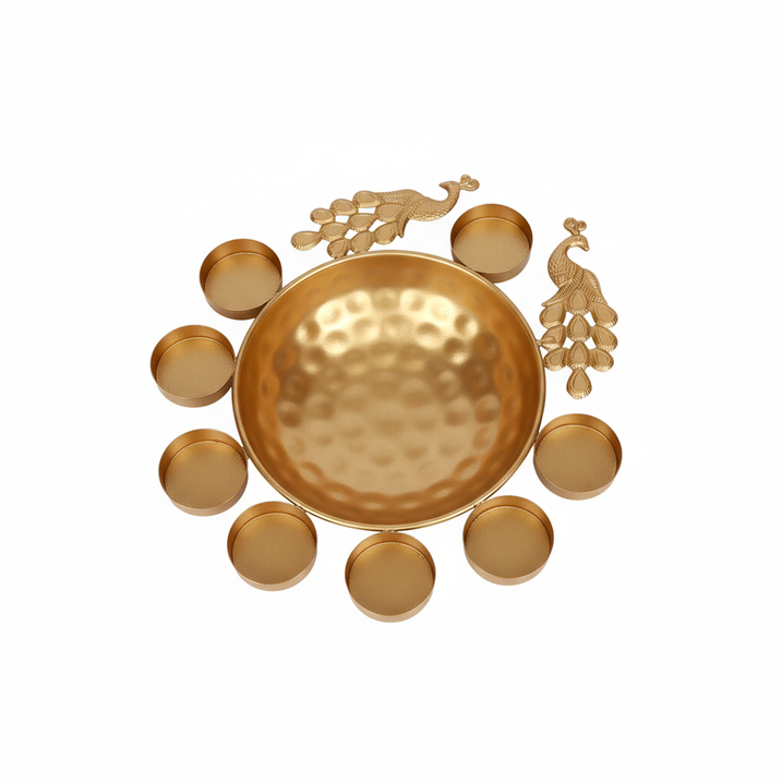 Golden metal peacock urli bowl with 8 diyas
