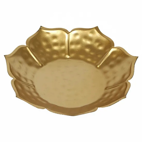 Golden metal flower-shaped urli bowl
